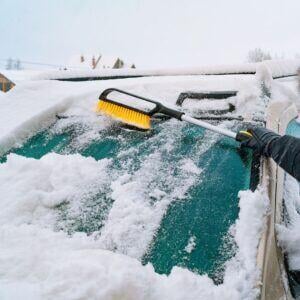 cleaning snow off windshield