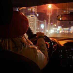 woman driving at night