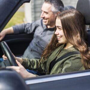 teen driving with a parent