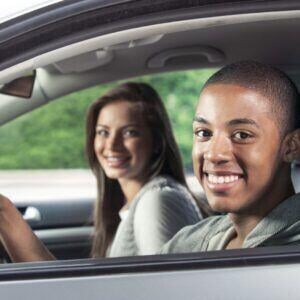 teen driving with a friend